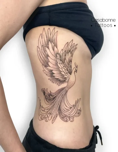 Tatouage d'un phénix, sur les côtes, à Toulouse